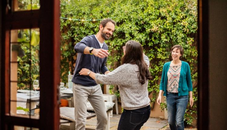 Guest Communication - Man greeting woman with a hug